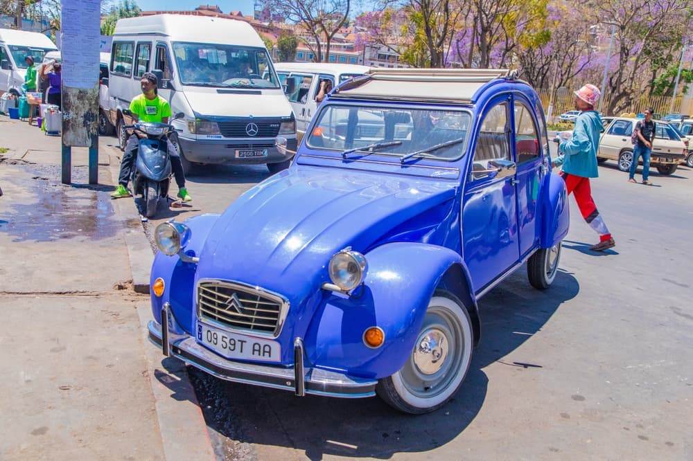 Bright blue Citroen parked on busy street, Antananarivo