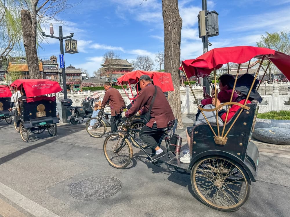 Bike cart drivers carry visitors to their destinations, Beijing