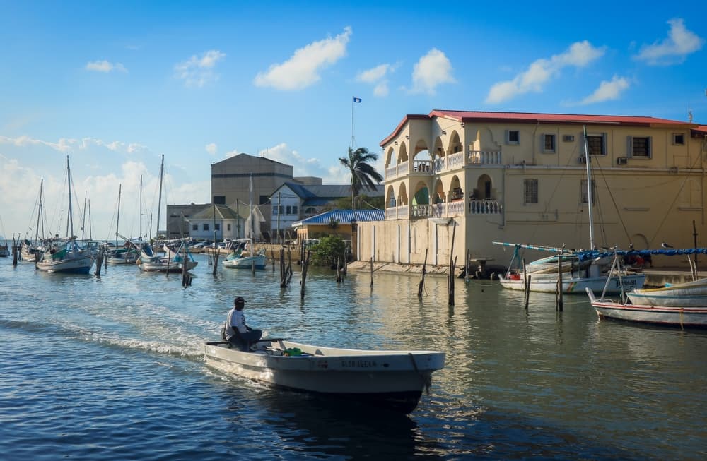 Motorboats glide down the river, Belize City
