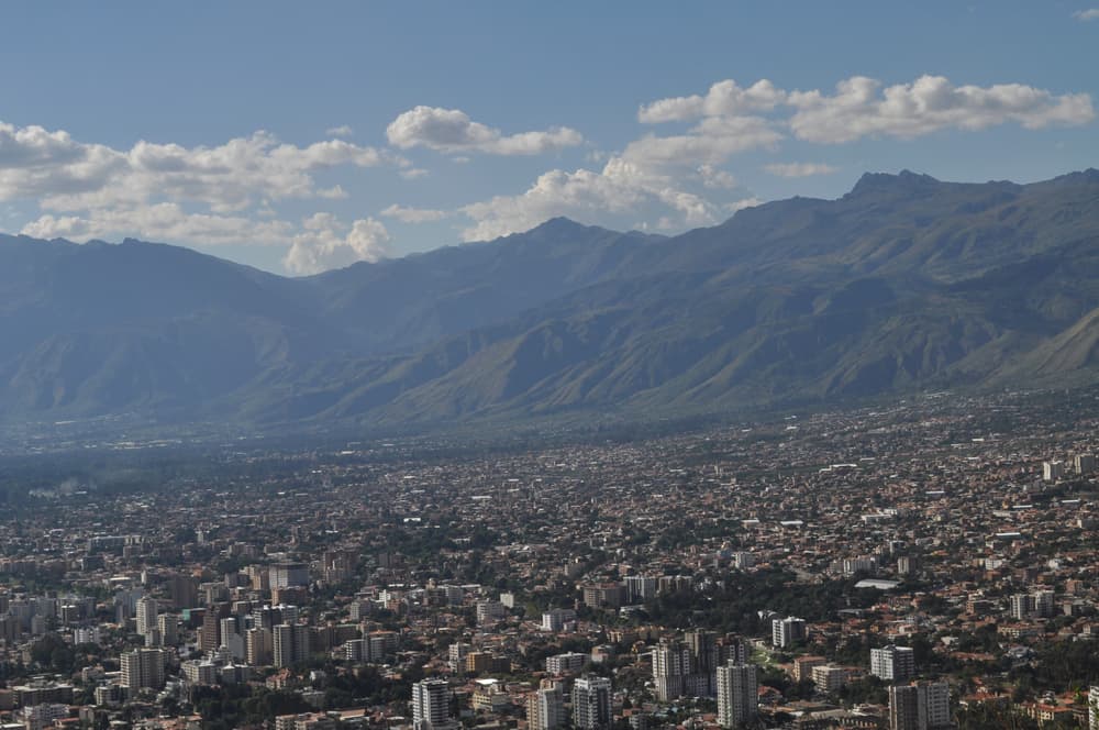 Aerial view of city surrounding mountains, Cochabamba