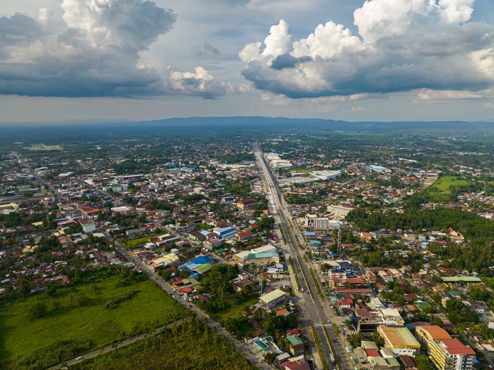 Commercial and residential buildings radiate from city center, Davao City
