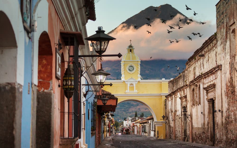 Colonial architecture with tall mountain rising beyond, Guatemala City