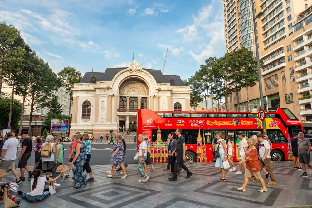 Americans walk towards Municipal Theatre, Ho Chi Minh City