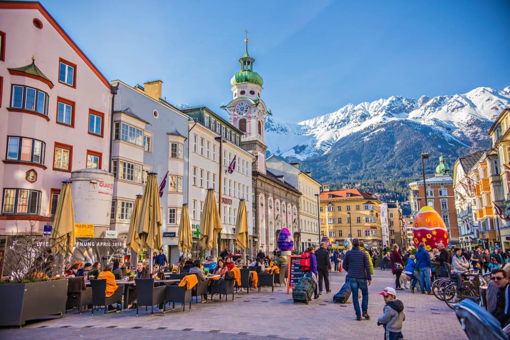 Locals enjoy outdoor cafes during brisk late morning, Innsbruck