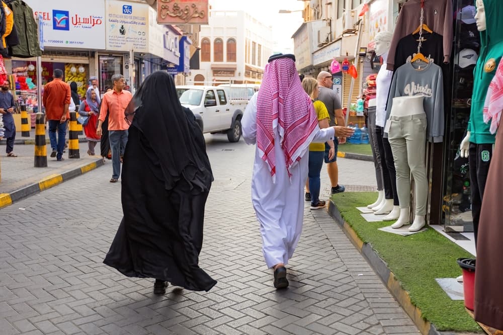 Arab couple wears traditional dress in town, Juffair