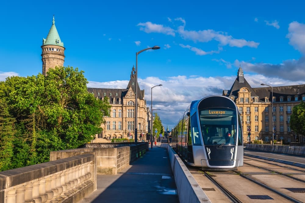 Clock tower overlooks train coming into station, Luxembourg City