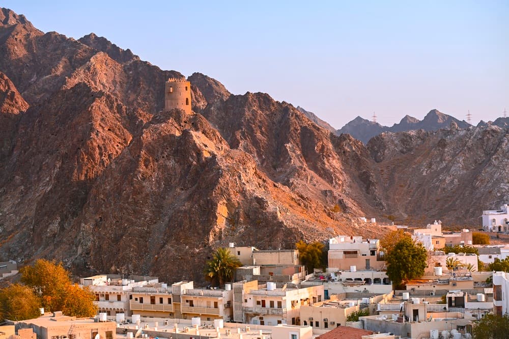 Historic fort remains overlook city from mountainside, Muscat