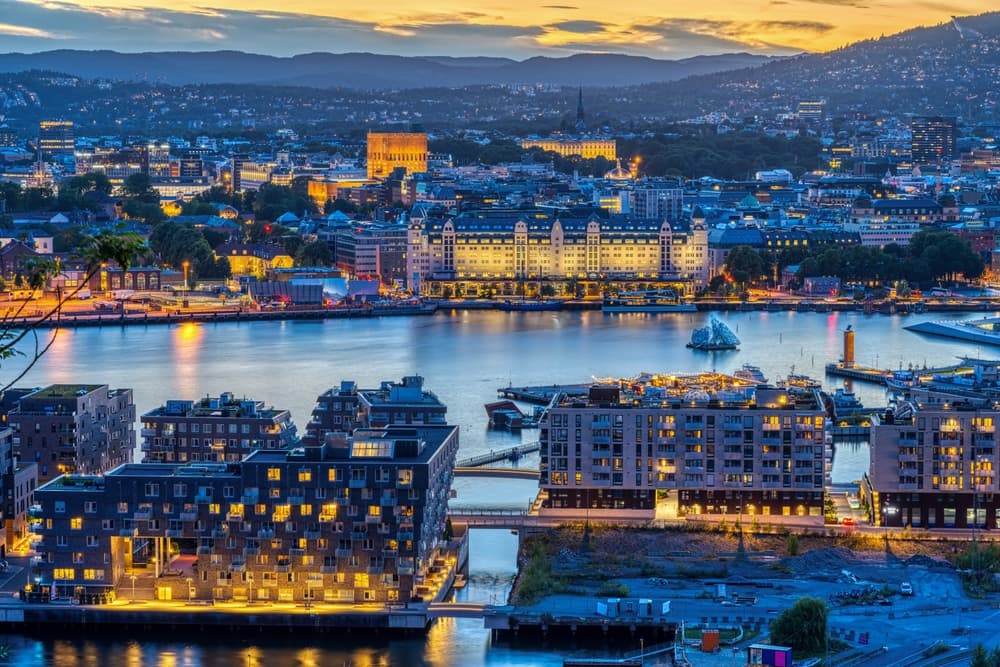 Cityscape along the river lit at early evening, Oslo