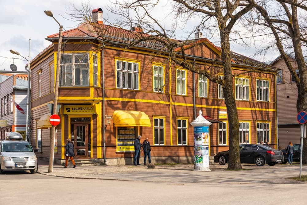Brown wooden building with yellow trim for Uus Maa real estate, Pärnu