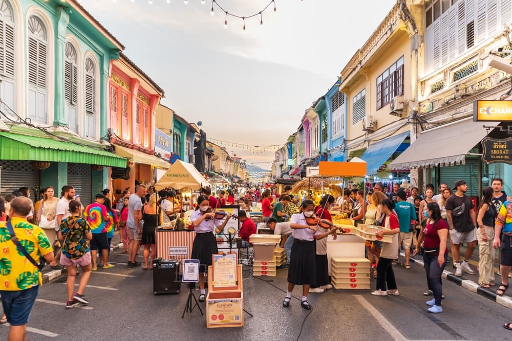 Crowd moves through vendor street for wares, Phuket City