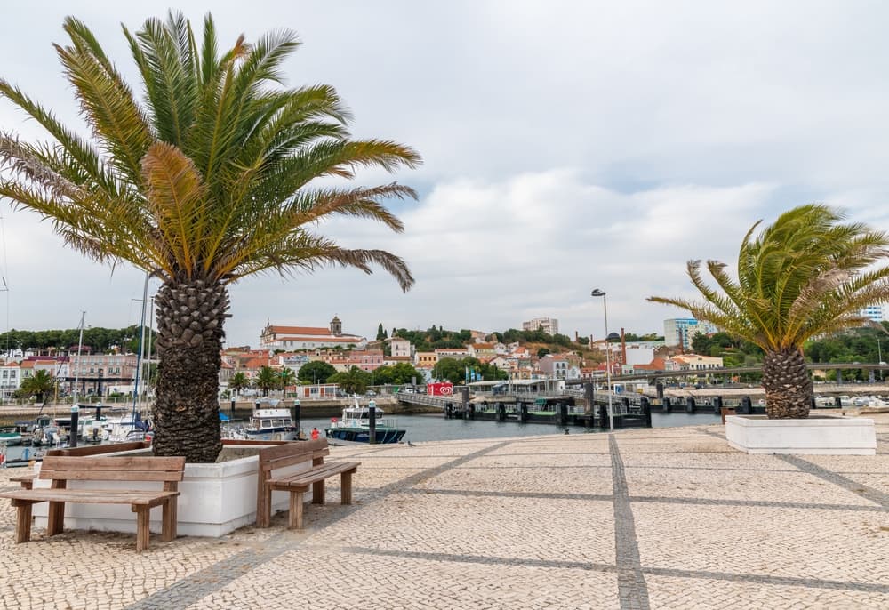Benches line tiled pavilion overlooking bay, Setúbal