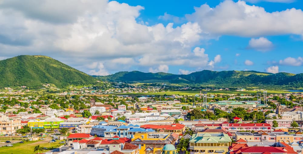 Saint Kitts brightly colored homes extend into distance, Sandy Point Town