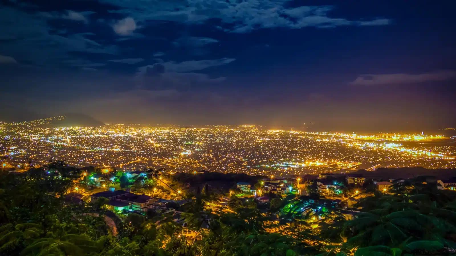 Kingston, Jamaica lit up at night, seen from the hills above the city