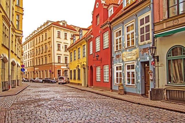 Cobblestone street of pastel buildings in Riga's Old Town