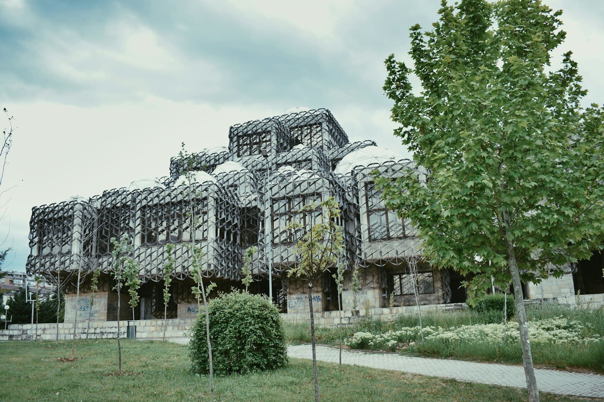 The domed, lattice-covered National Library building in Pristina