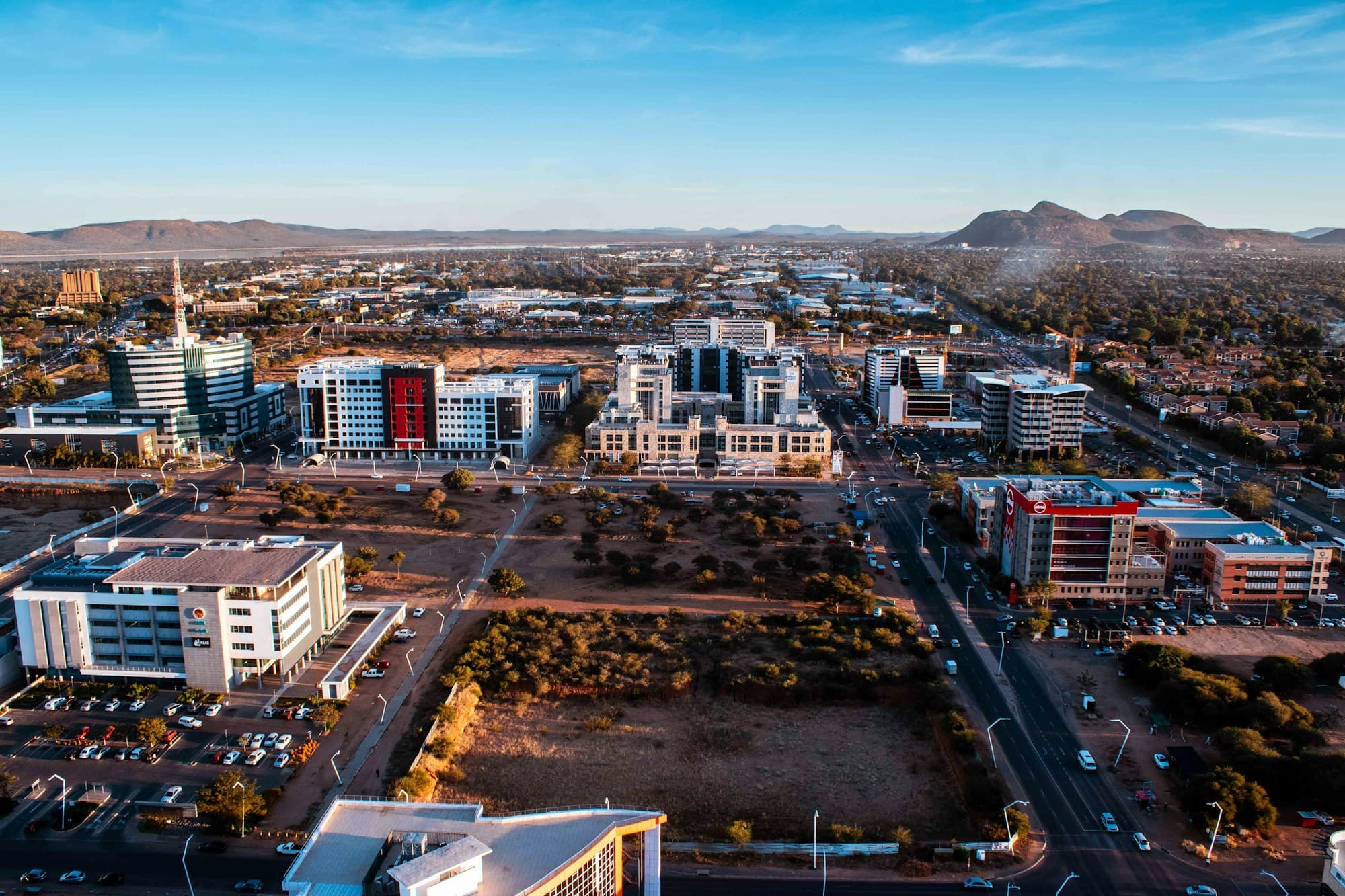 Aerial view of the central business district in Gaborone, Botswana, with office blocks and hills on the horizon