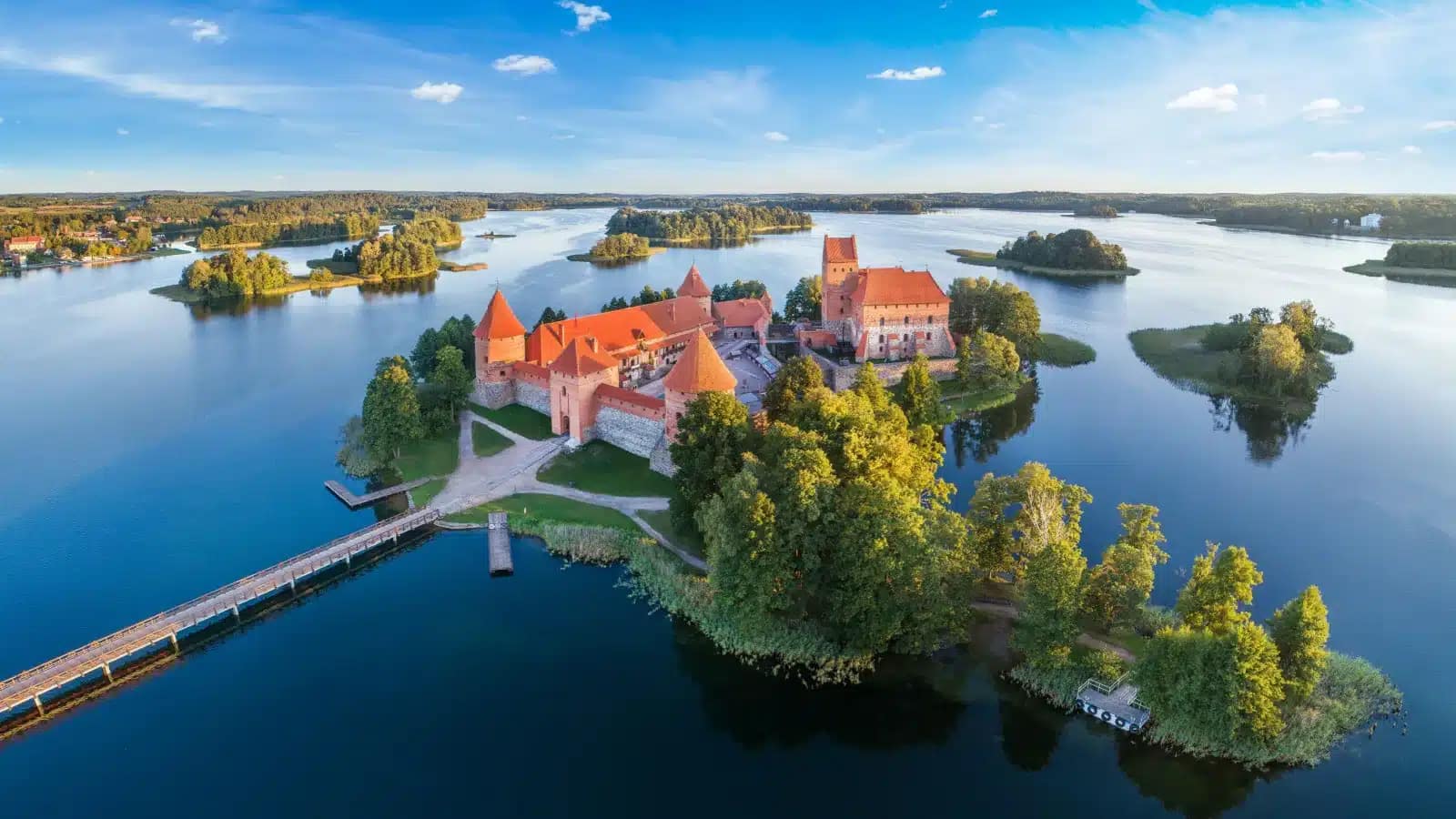 Aerial view of Trakai Island Castle, a red-brick fortress on a lake island west of Vilnius