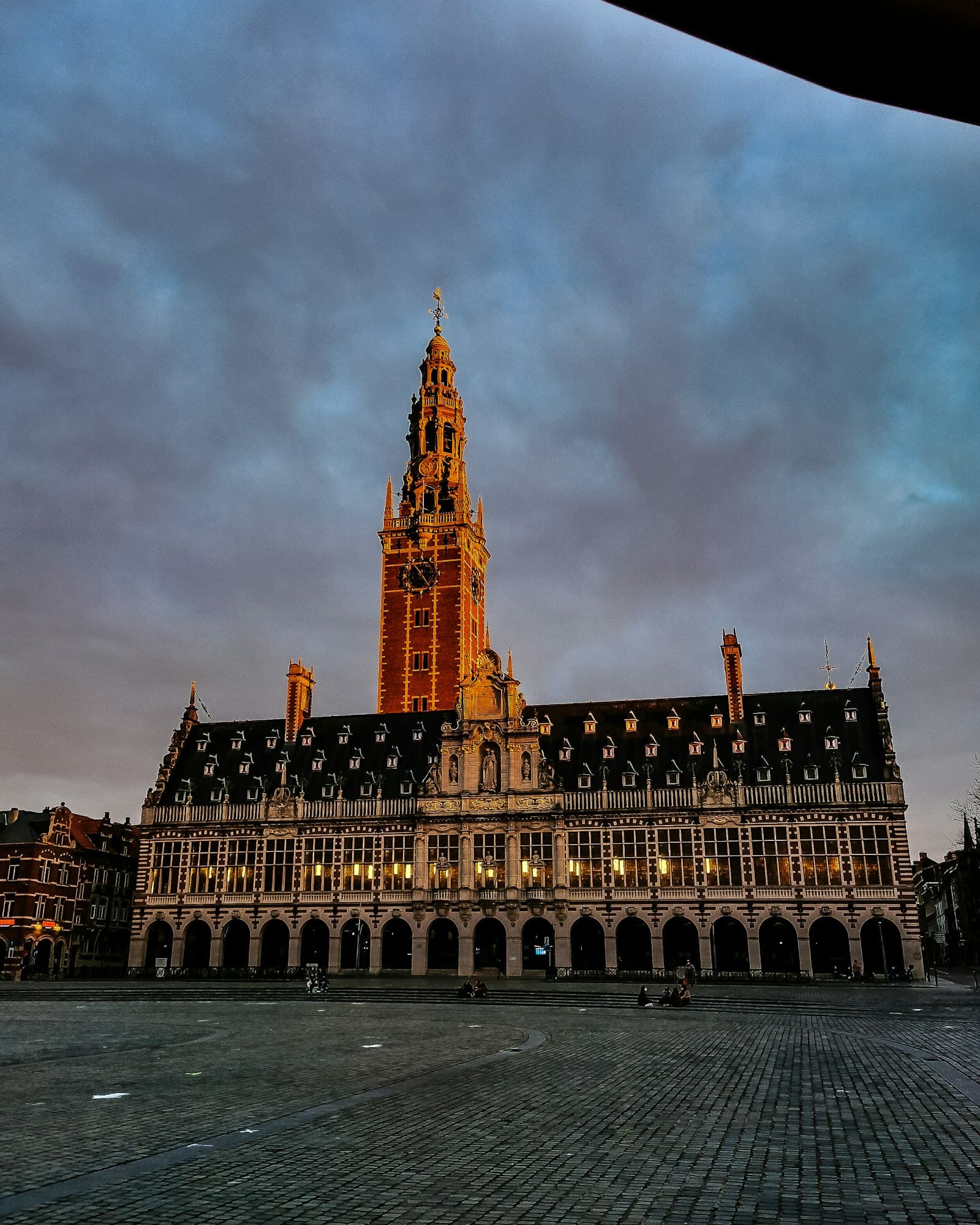 The KU Leuven University Library tower on Ladeuzeplein in Leuven at sunset
