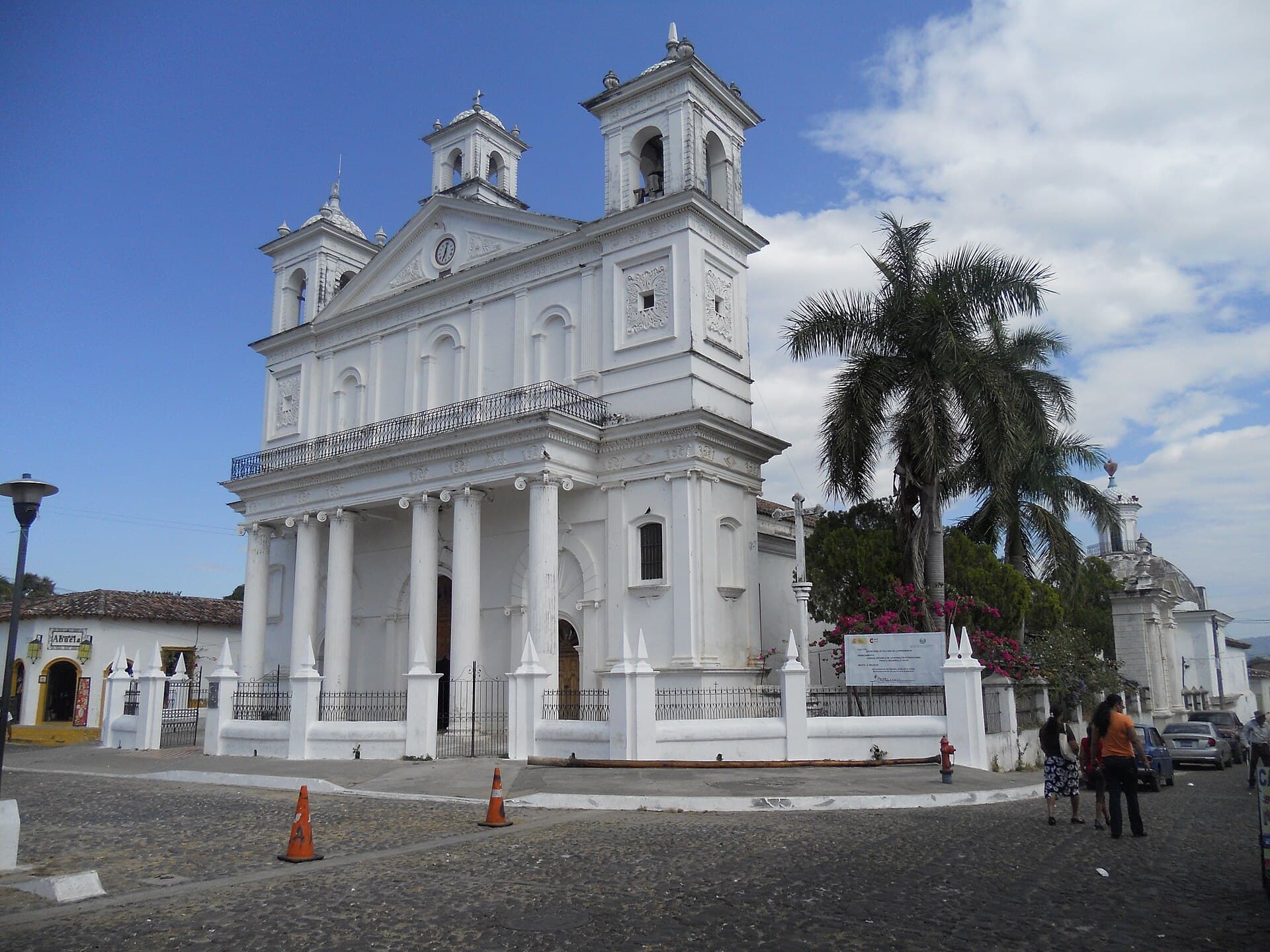 The white colonial church of Santa Lucía on a cobblestone plaza in Suchitoto, El Salvador