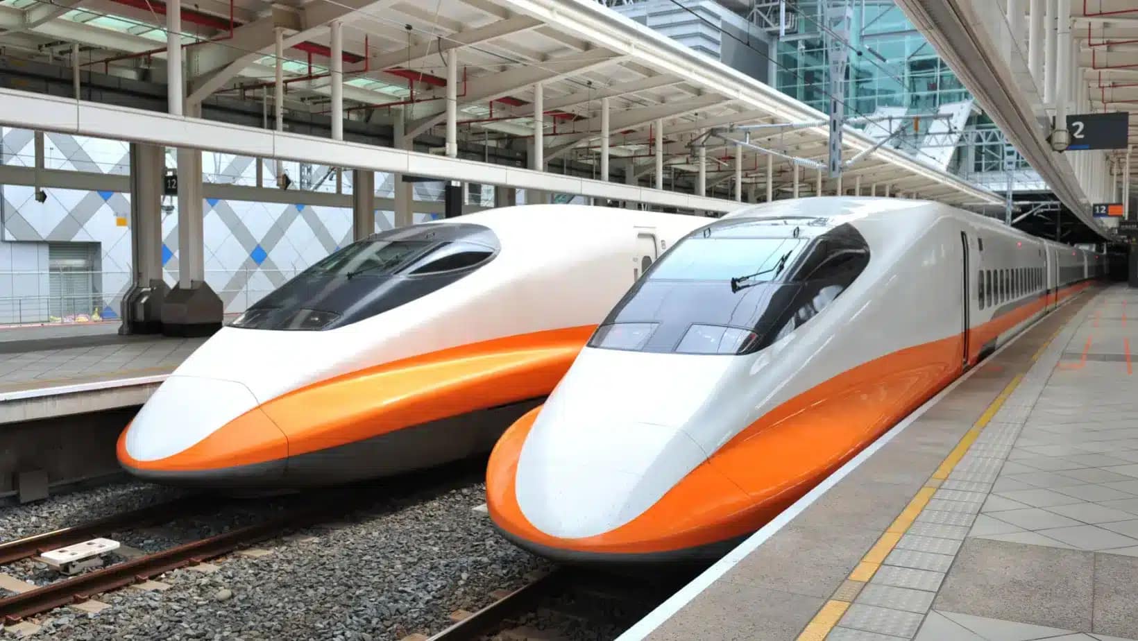 Two Taiwan High Speed Rail trains waiting at a station platform