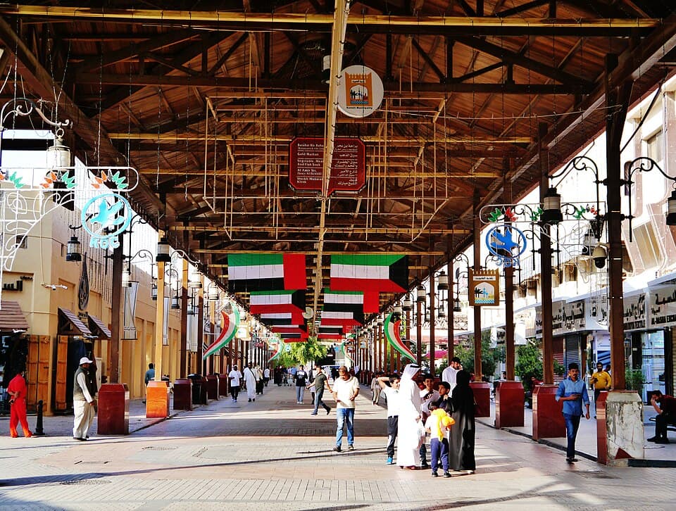 Kuwaiti flags hanging from the wooden roof of Souq Al-Mubarakiya in Kuwait City