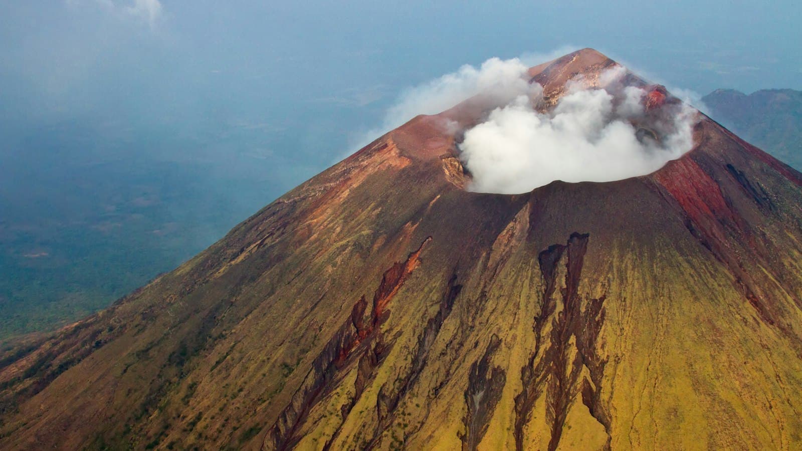 Aerial view of a steaming volcano crater in western Nicaragua