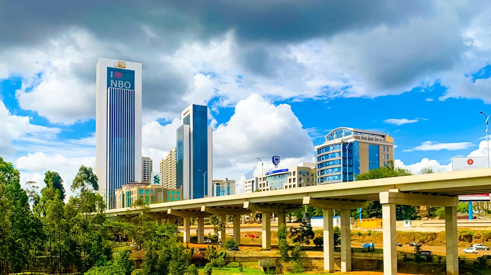 Nairobi office towers and an elevated expressway under a bright sky