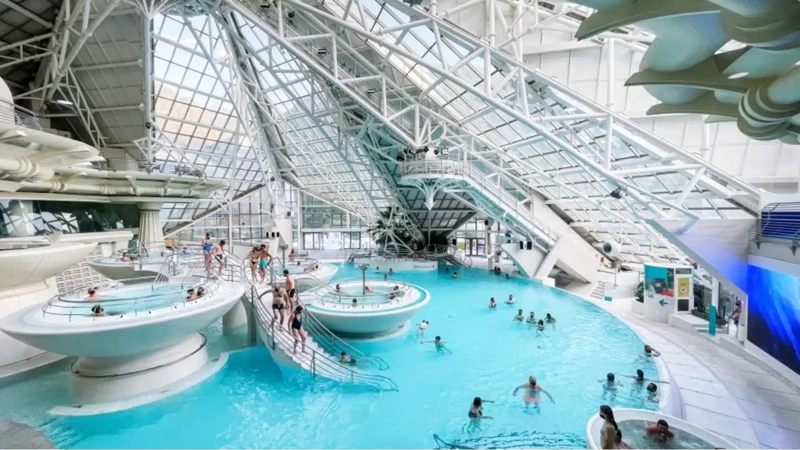 Indoor thermal pools under a glass roof at a spa in Andorra
