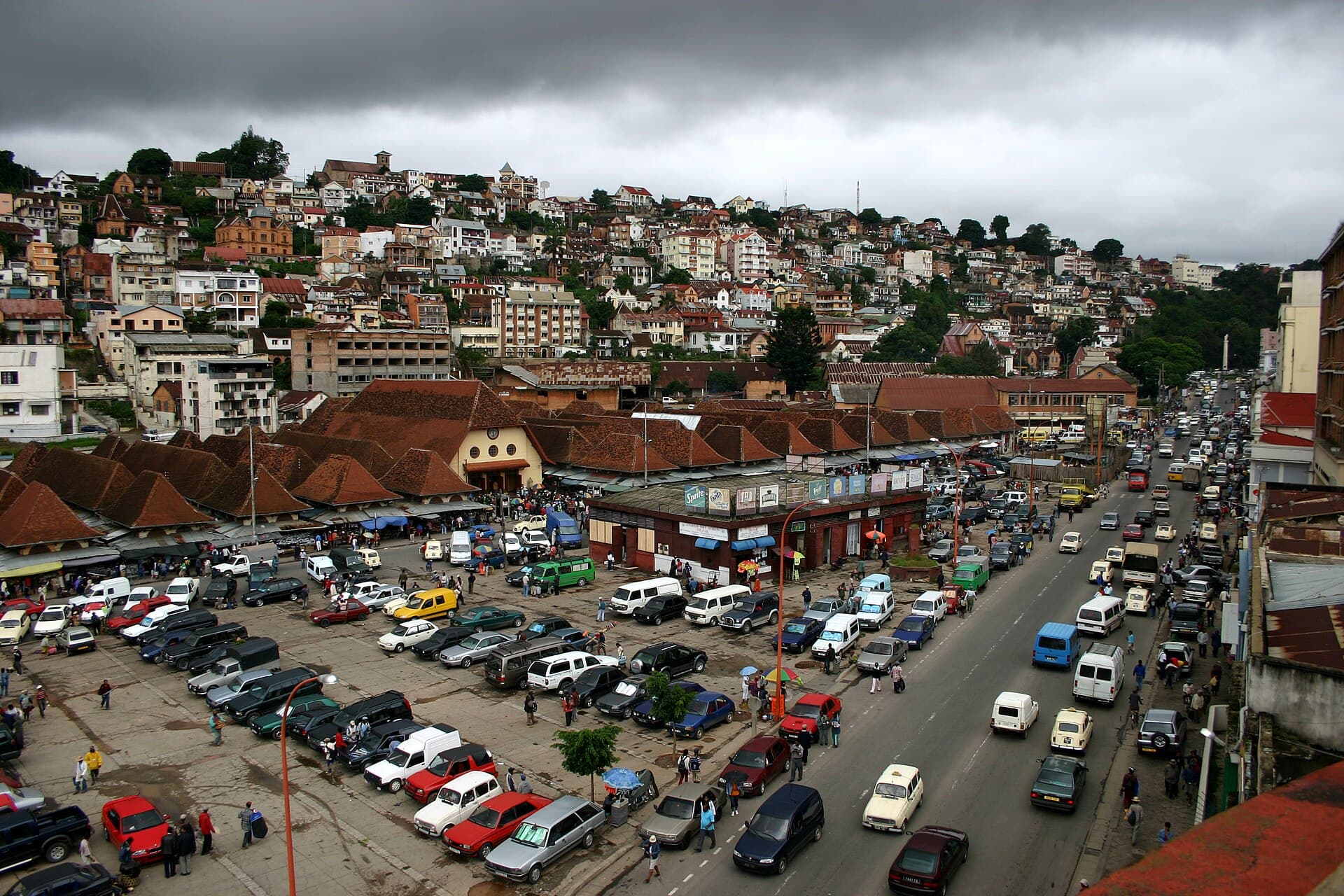 Busy Analakely district in central Antananarivo, with hillside houses above
