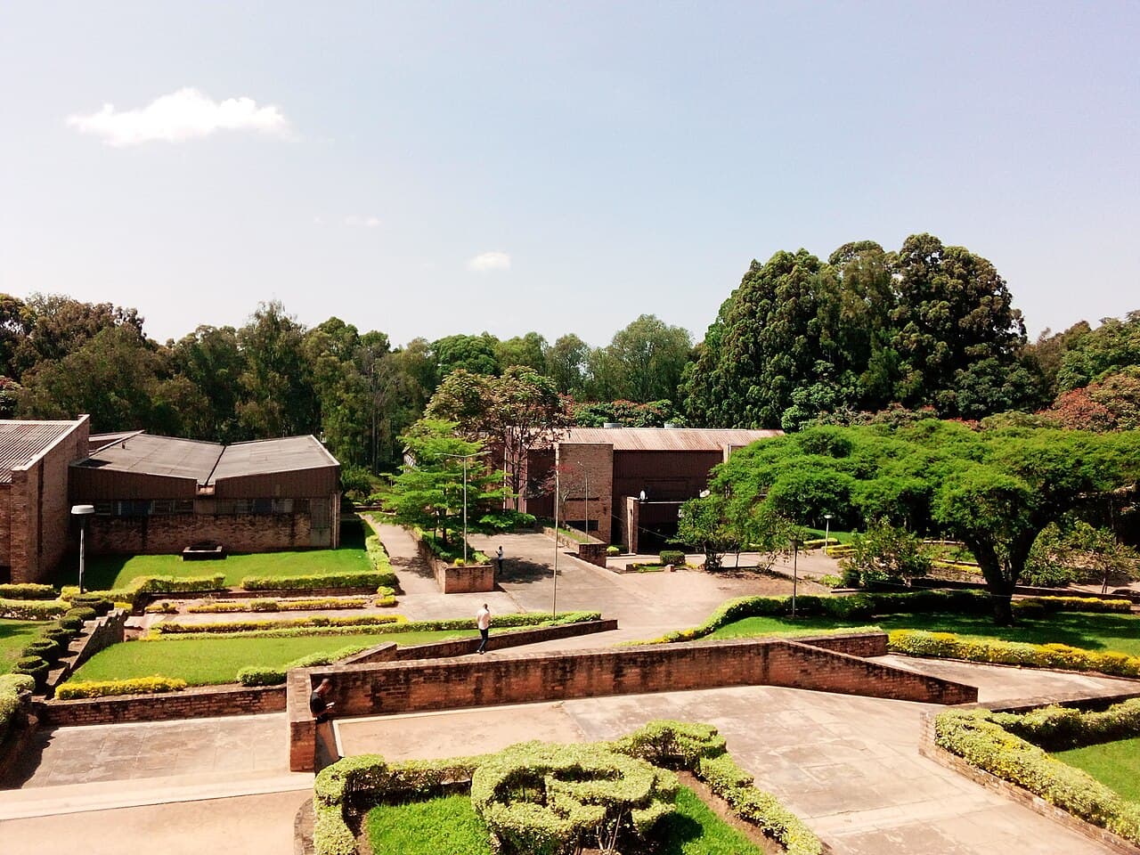 Brick buildings, lawns and trees on the University of Rwanda's Huye campus