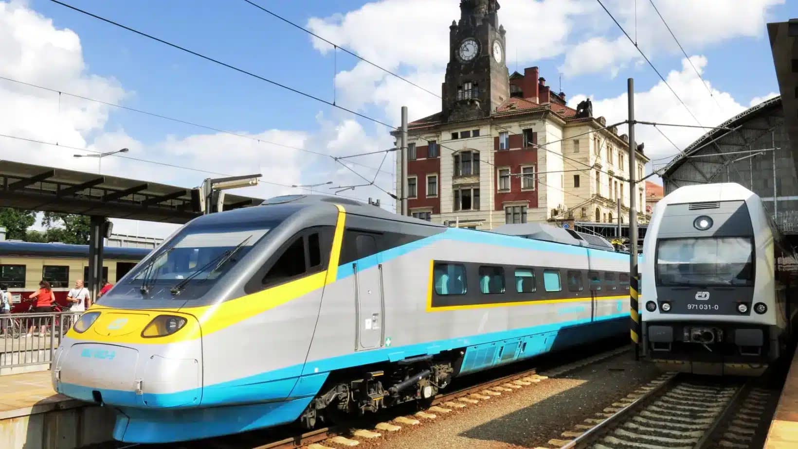 A high-speed train waiting at a Prague railway station