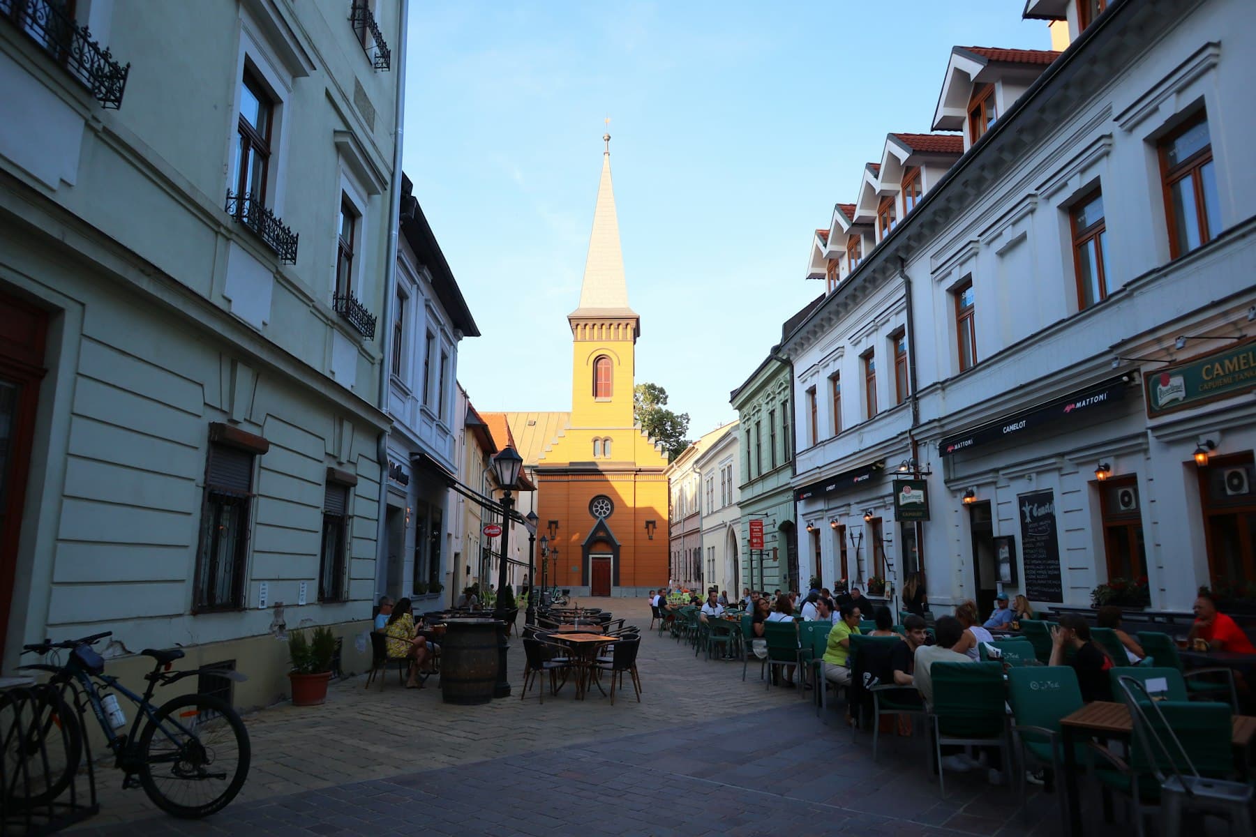 Outdoor café tables on a pedestrian street in Košice's old town