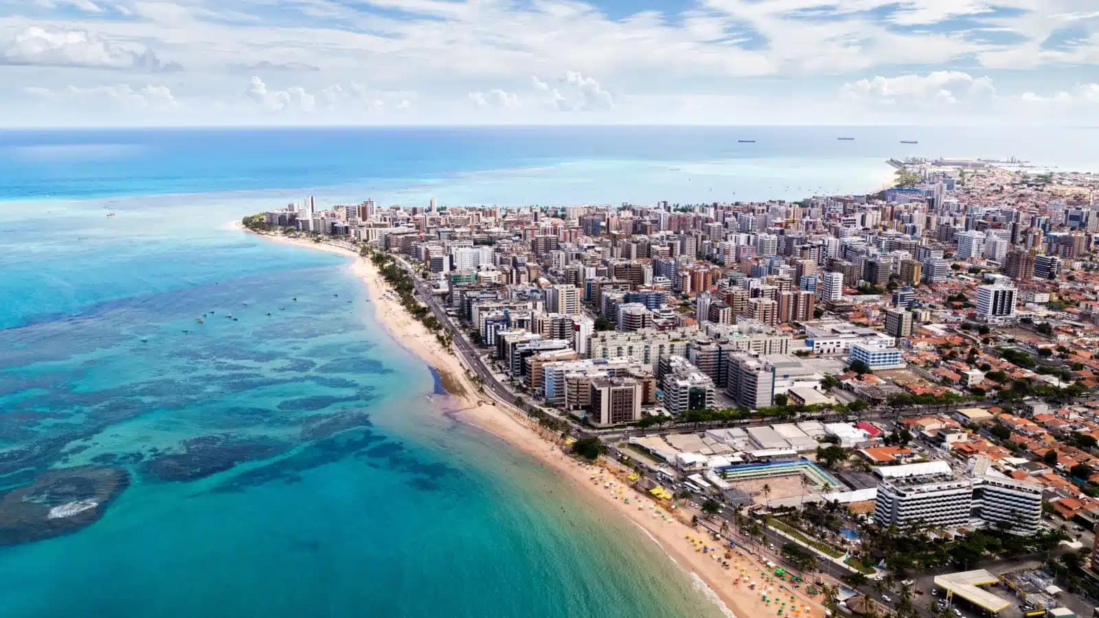 Aerial view of apartment towers along the turquoise coast of Maceió in Brazil's Northeast