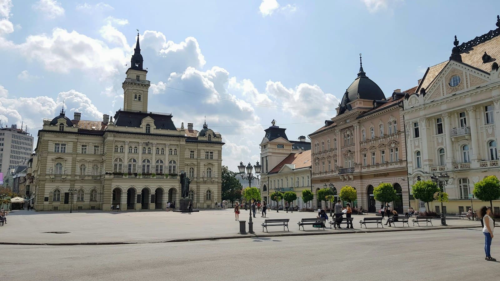 Liberty Square in Novi Sad with the City Hall and pastel facades under a summer sky