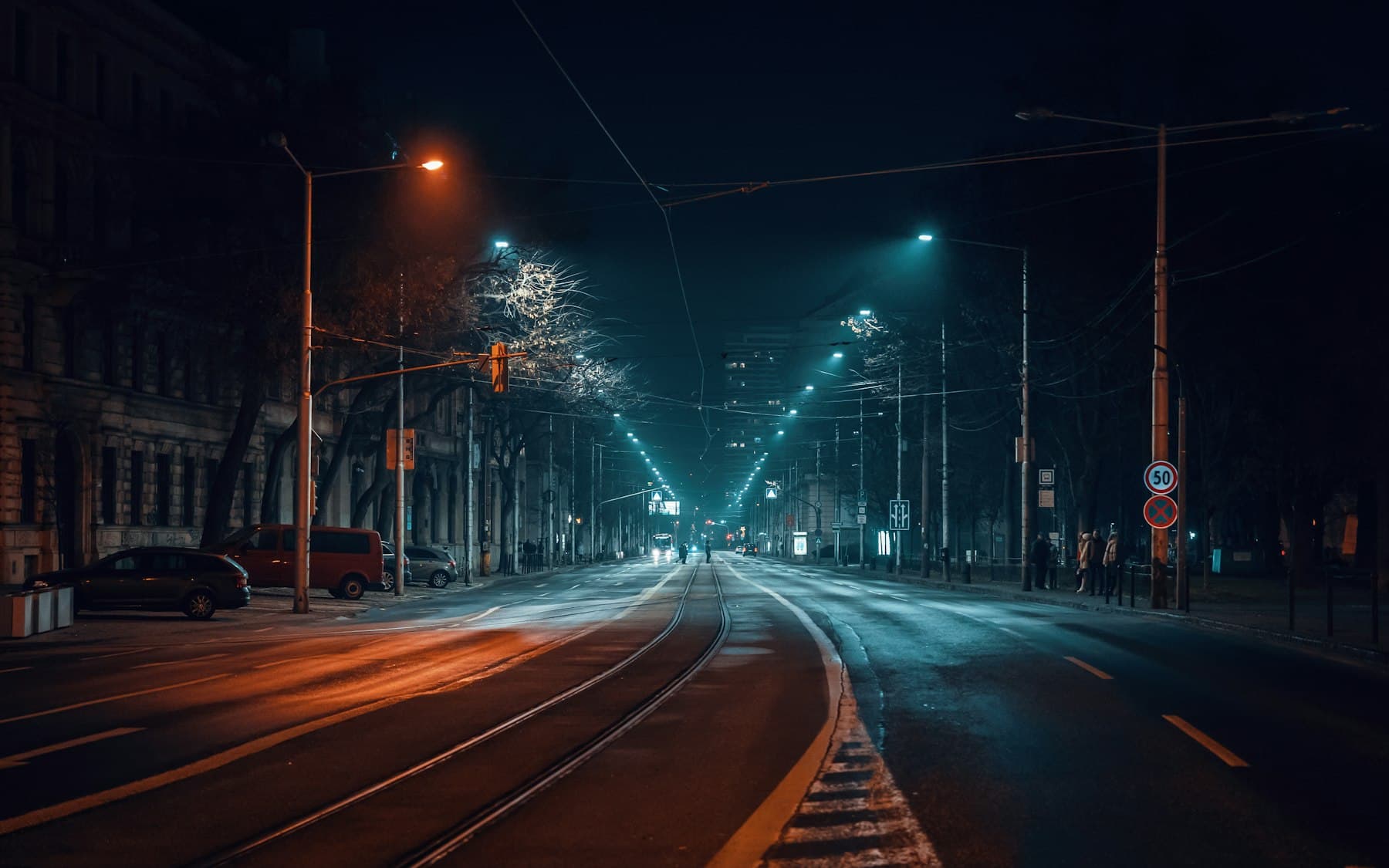Tram tracks and street lights on a Bratislava avenue at night