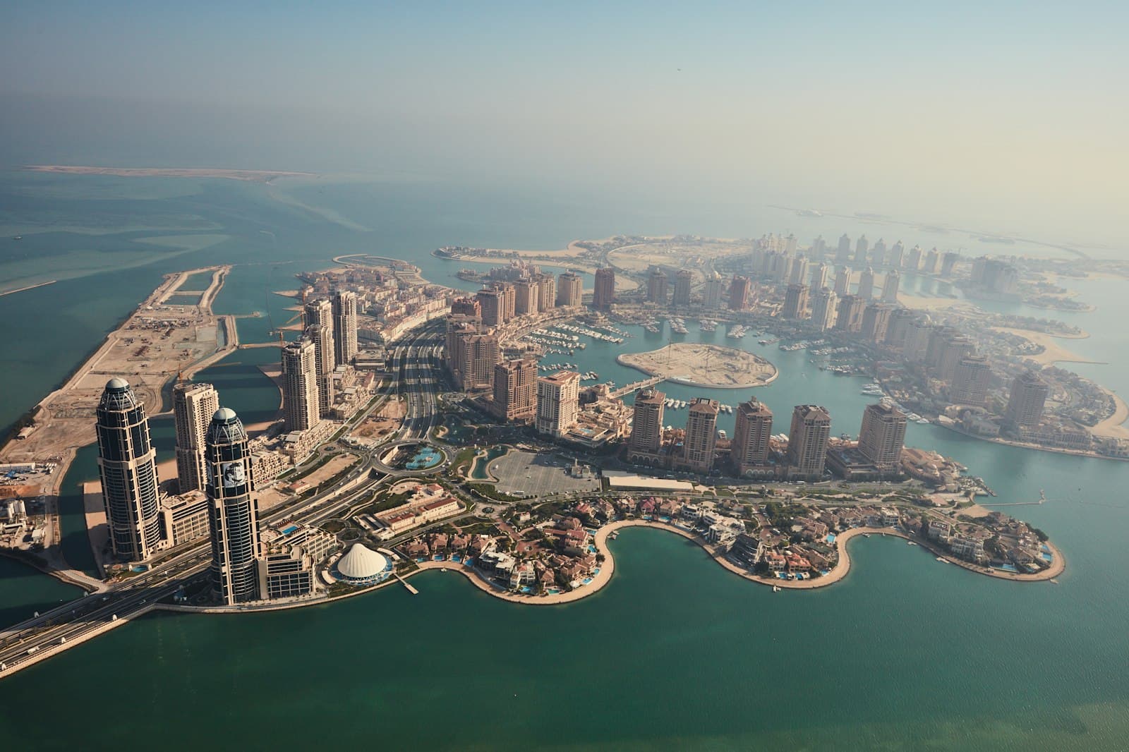 Aerial view of The Pearl in Doha, with residential towers, marinas and waterfront villas
