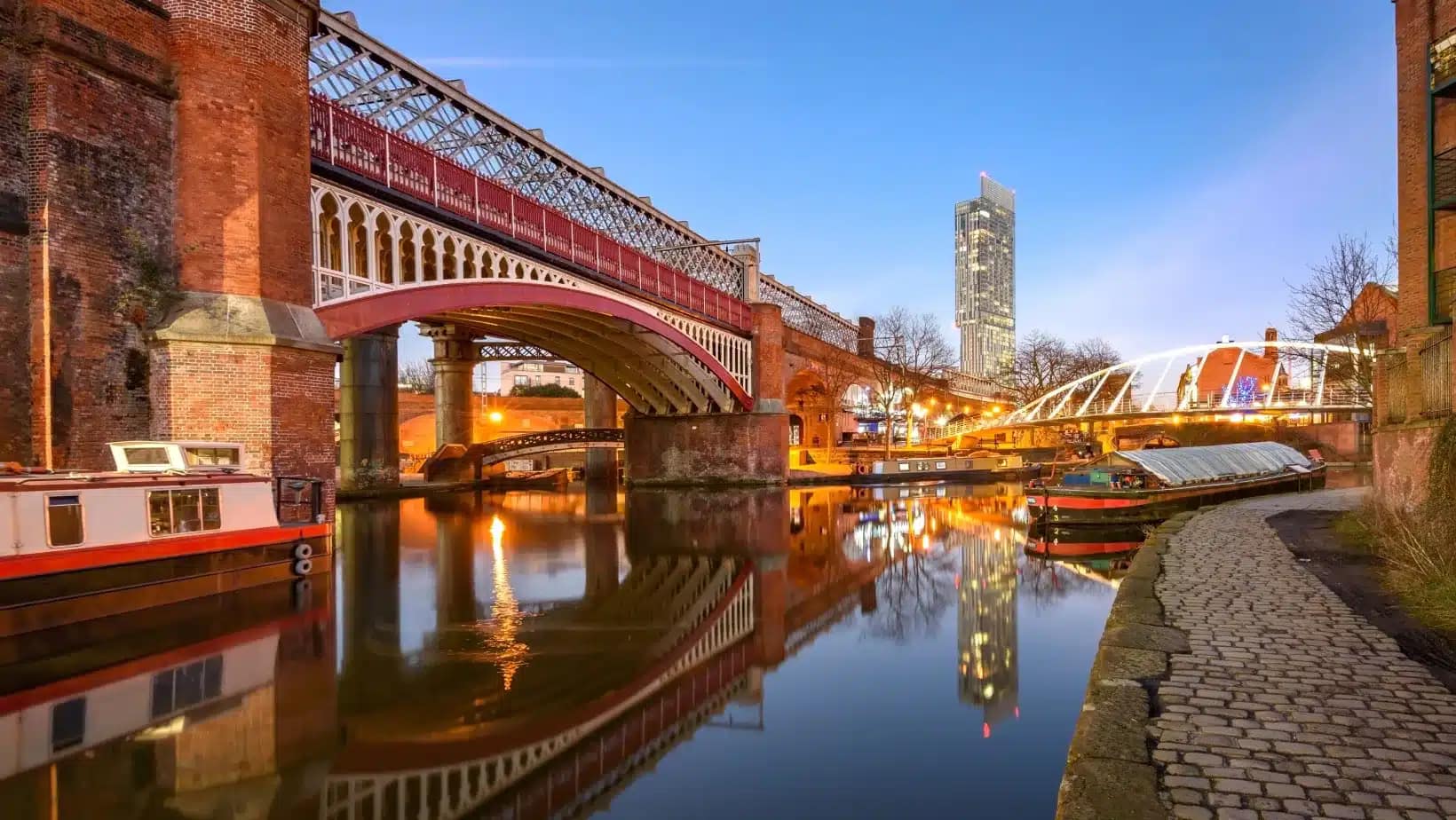 Castlefield canal and railway viaducts in Manchester at dusk