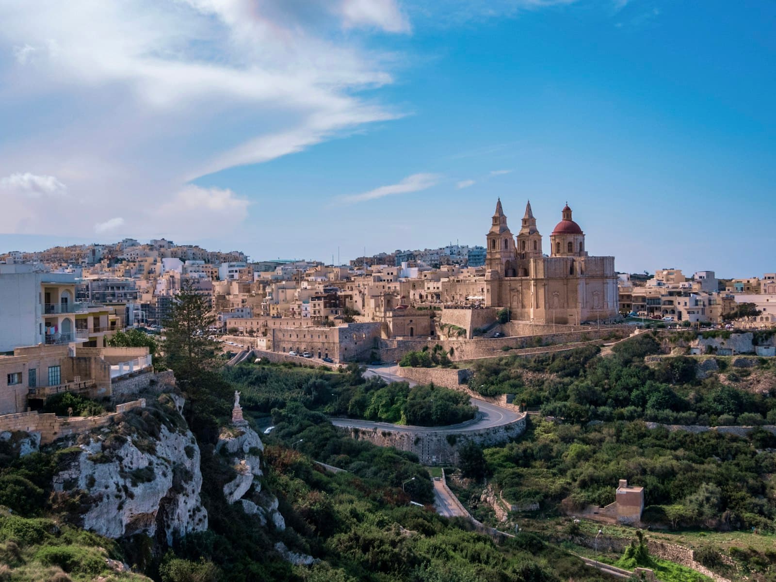 The parish church of Mellieħa above the town's hillside homes in northern Malta