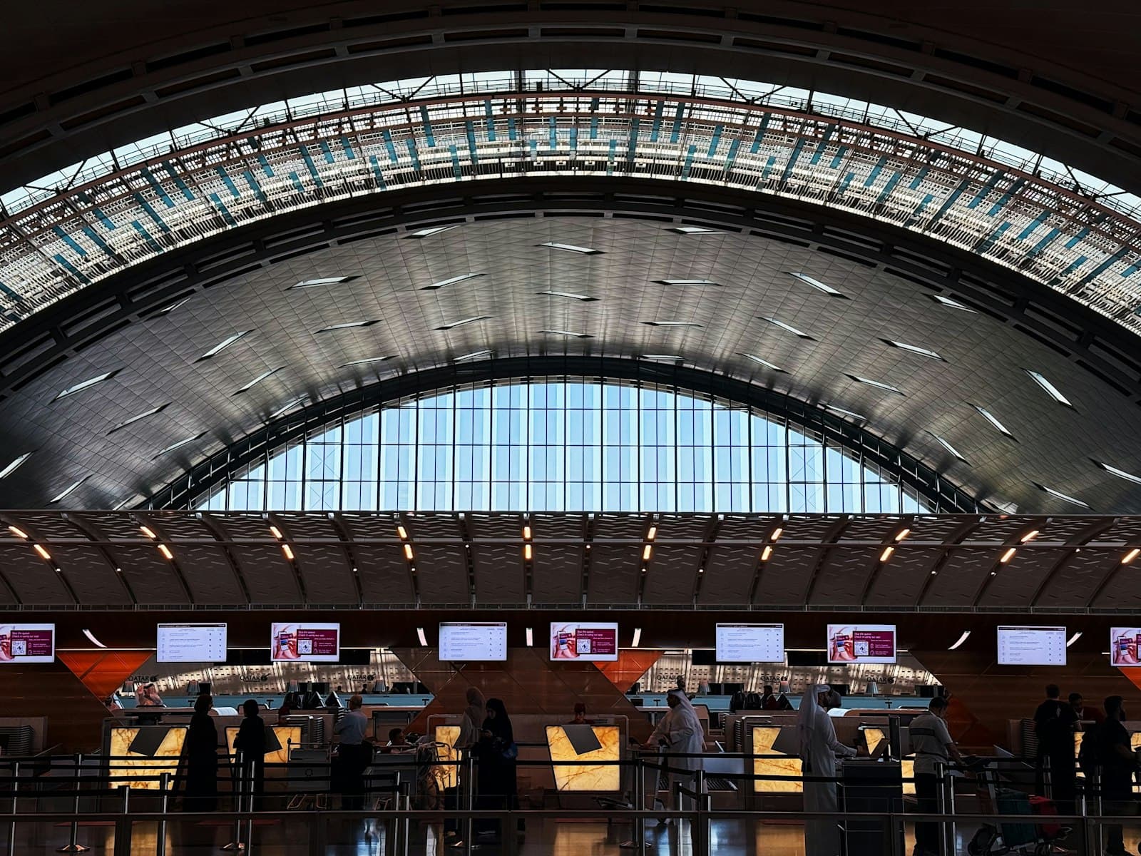 Arched check-in hall at Hamad International Airport in Doha