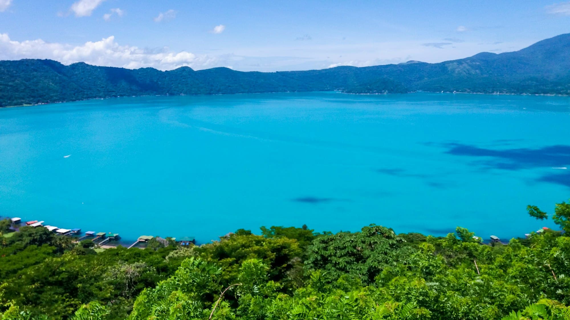 Lake Coatepeque, a turquoise crater lake ringed by green hills in western El Salvador