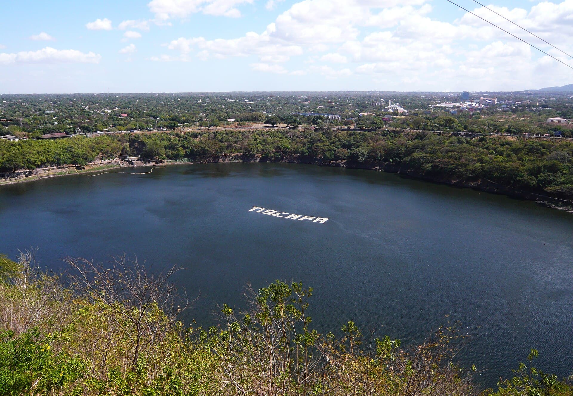 Tiscapa crater lagoon in Managua, Nicaragua, with the city spreading out behind it