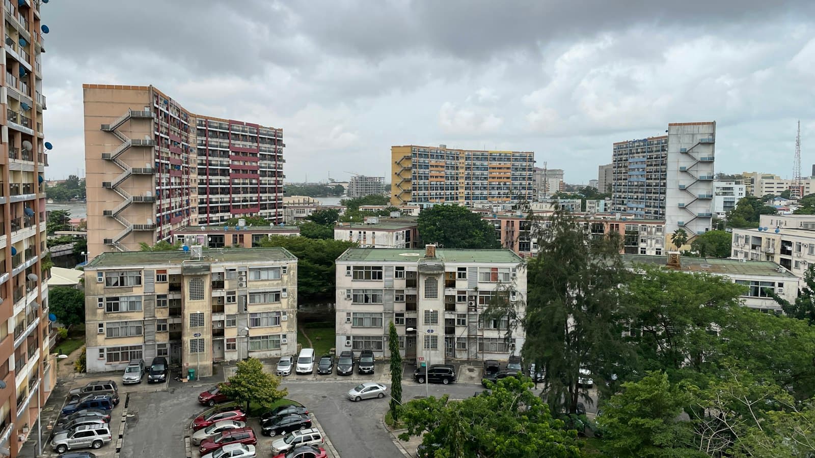 Apartment blocks and trees under a cloudy sky in Lagos