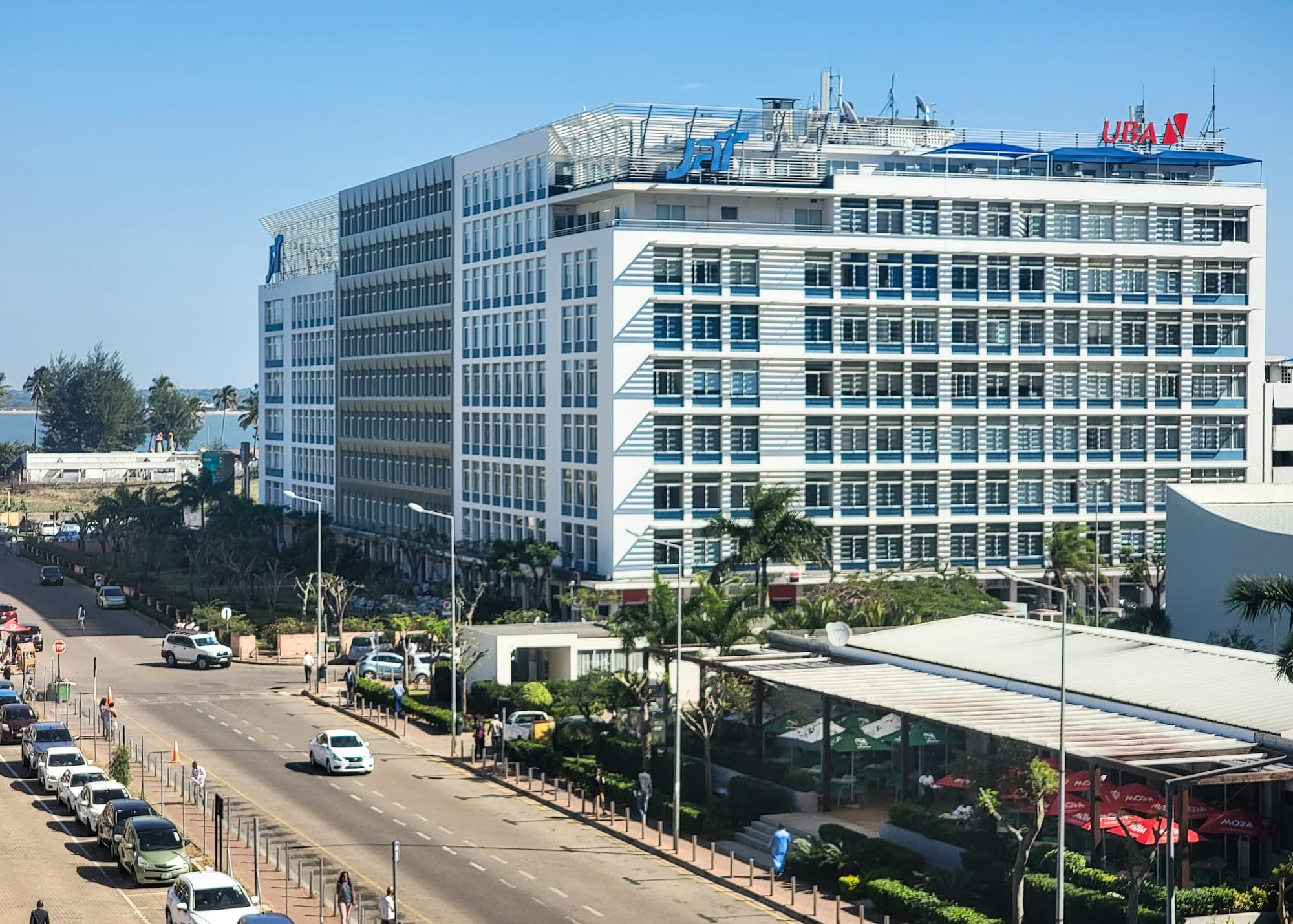 Office building and palm-lined avenue near the bay in Maputo, Mozambique