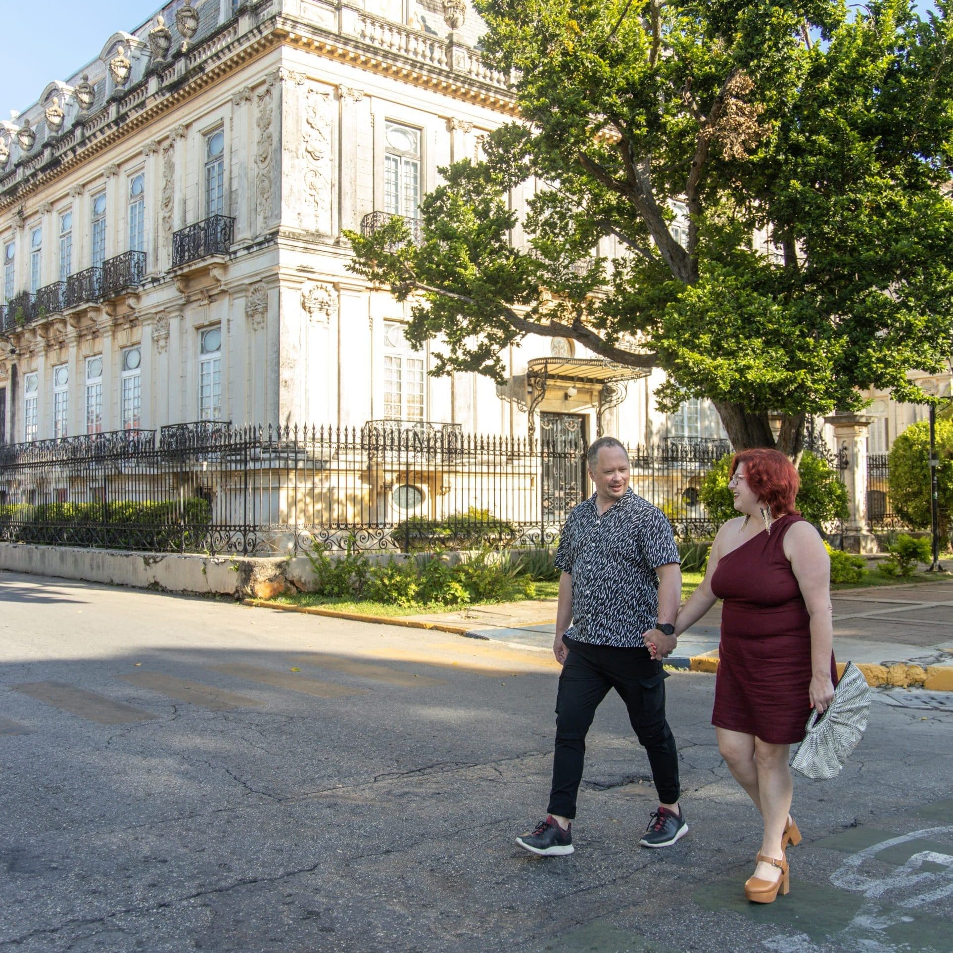 Jen Barnett walking down a tree-lined street
