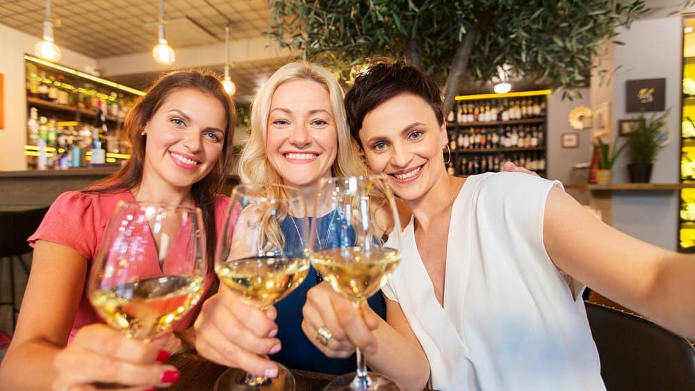 Friends toasting glasses of wine together
